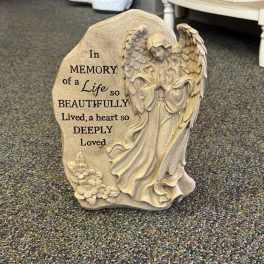 Memorial stone with an angel and engraved sympathy message