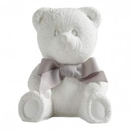 White teddy bear with a gray ribbon bow