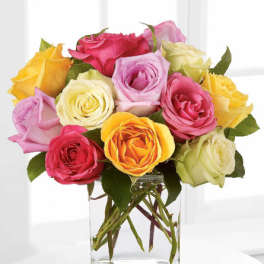 Colorful rose bouquet in a clear glass vase