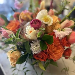 Mixed bouquet with orange, pink, and white flowers