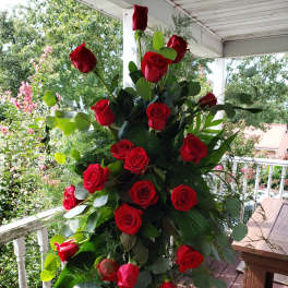 Tall bouquet of red roses with eucalyptus greenery