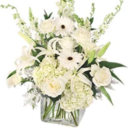 White floral arrangement in a clear glass vase