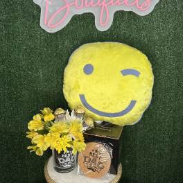 Yellow flower gift set with a smiley-face pillow and Dad-themed items