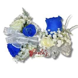 Two small rose arrangements with blue and white roses and baby’s breath