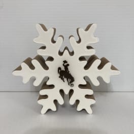 White snowflake-shaped decorative sign with a cowboy logo