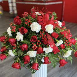 Large bouquet of red roses and white carnations with berries