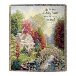 Decorative woven throw with a house, garden, and scripture text