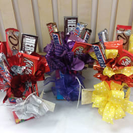 Candy gift bouquets with chocolate bars and large ribbon bows