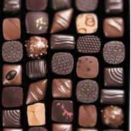 Assorted chocolates in a box with varied square pieces