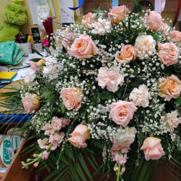 Large bouquet of pale pink roses and white filler flowers