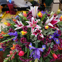 Large mixed bouquet with lilies, tulips, irises, and chrysanthemums
