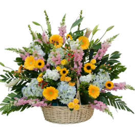 Basket arrangement of yellow, pink, and white flowers