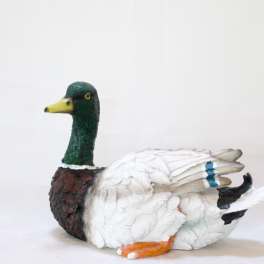 Decorative duck figurine with a green head and white body