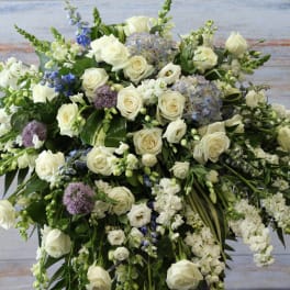 Large white floral spray with roses and lavender accents