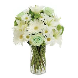 White flowers arranged in a clear glass vase