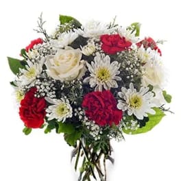 Bouquet of red and white flowers in a clear glass vase