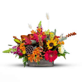 Colorful mixed flower arrangement in a wooden box
