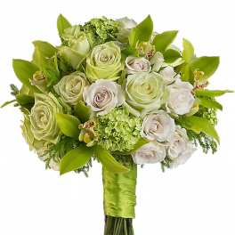 Hand-tied bouquet of white and green roses with green hydrangea and orchids wrapped in bright green ribbon