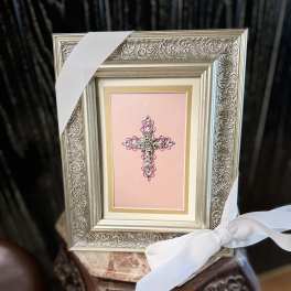 Framed pink cross ornament with white ribbon bow