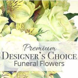 Yellow and white funeral flower arrangement with lilies and alstroemeria