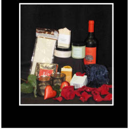 Gift set with wine, candles, and red roses on a black background