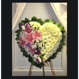 Heart-shaped floral standing spray with pink lilies and white chrysanthemums
