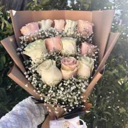 Bouquet of pale pink and white roses with baby's breath
