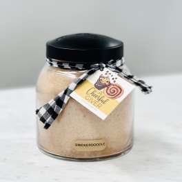 Jar of snickerdoodle mix with a black lid and ribbon tag