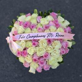 Pink and cream rose bouquet with a birthday ribbon