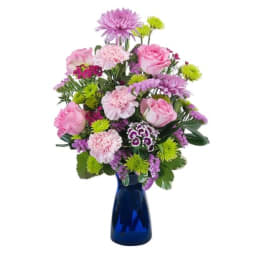 Pink and purple mixed bouquet in a blue vase