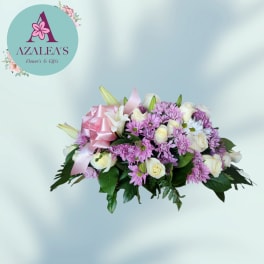 Pink and white flower bouquet with a satin ribbon