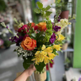 Handheld bouquet with orange roses and yellow alstroemeria