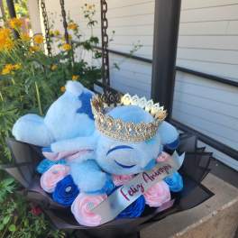 Blue teddy bear bouquet with pink and blue roses and a jeweled crown