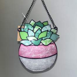 Hanging succulent-shaped wall decor with a black chain