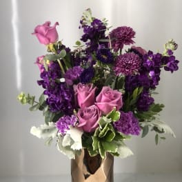 Pink and purple bouquet in a metallic vase