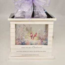 Decorative memorial lantern with a lavender bow and cardinal artwork