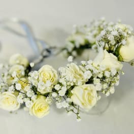 White rose floral crown with baby's breath on a clear band