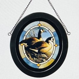 Round hanging plaque with a painted goose scene