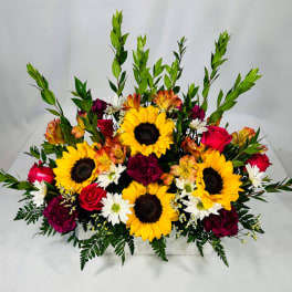 Mixed bouquet with sunflowers, roses, and white daisies