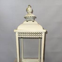 Decorative cream metal lantern with glass panels