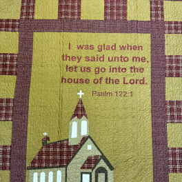 Quilted wall hanging with a church and Psalm 122:1 text