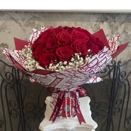 Red Roses With Baby Breath In Designed Wrapping Waterproof Paper