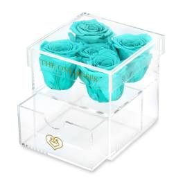 Turquoise roses in a clear acrylic box with a drawer