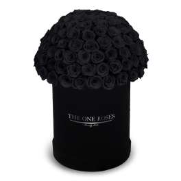 Black roses arranged in a round black box