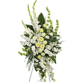Tall white and pale yellow floral standing spray on an easel