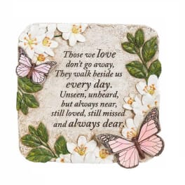 Decorative memorial plaque with flowers, butterflies, and a sympathy quote