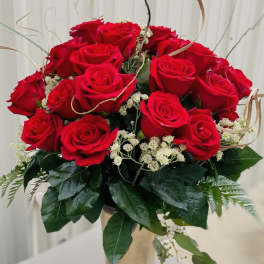 Bouquet of red roses with white filler flowers and greenery