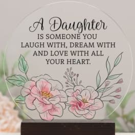 Decorative plaque with floral illustration and daughter quote on a wooden base