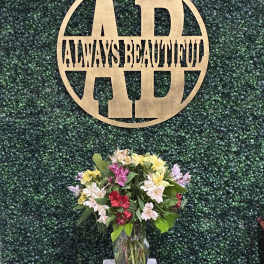 Mixed bouquet of colorful flowers in a glass vase