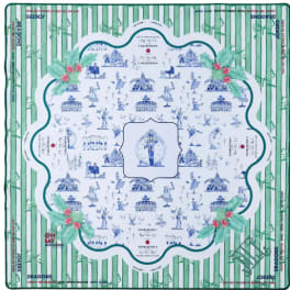 Decorative square fabric with green stripes and blue toile-style illustrations